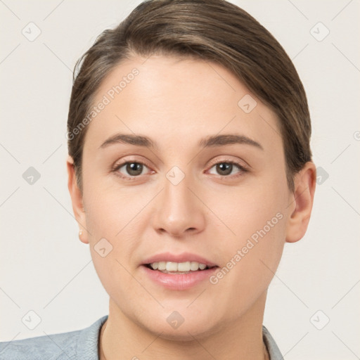 Joyful white young-adult female with short  brown hair and brown eyes