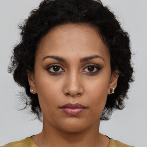 Neutral black young-adult female with short  brown hair and brown eyes