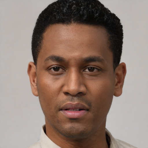 Neutral latino young-adult male with short  black hair and brown eyes