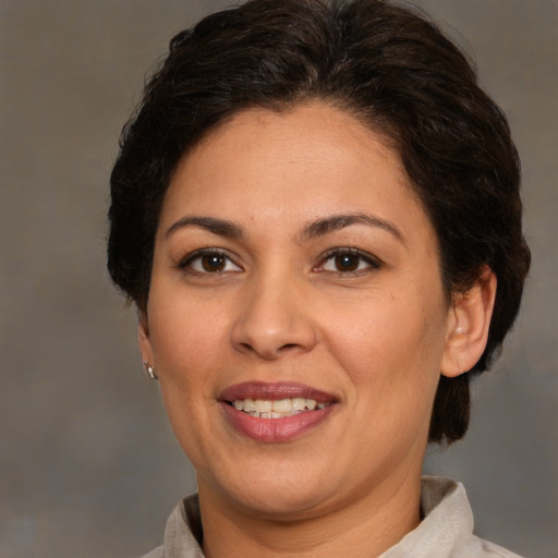 Joyful white adult female with medium  brown hair and brown eyes