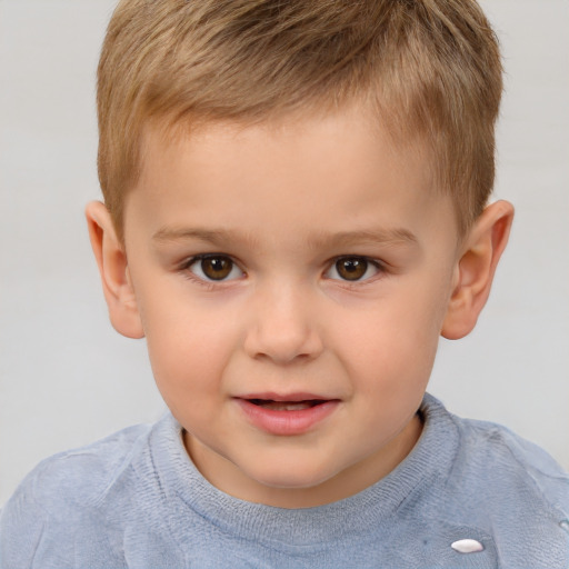 Joyful white child male with short  brown hair and brown eyes