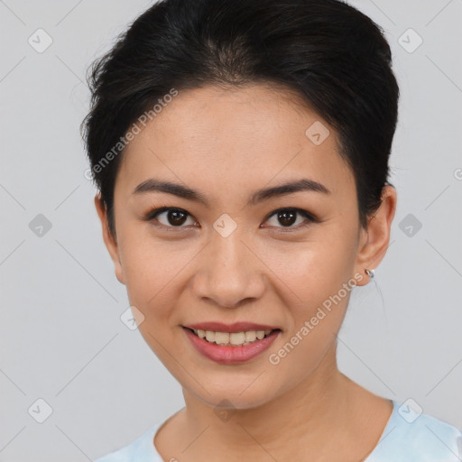 Joyful asian young-adult female with short  brown hair and brown eyes