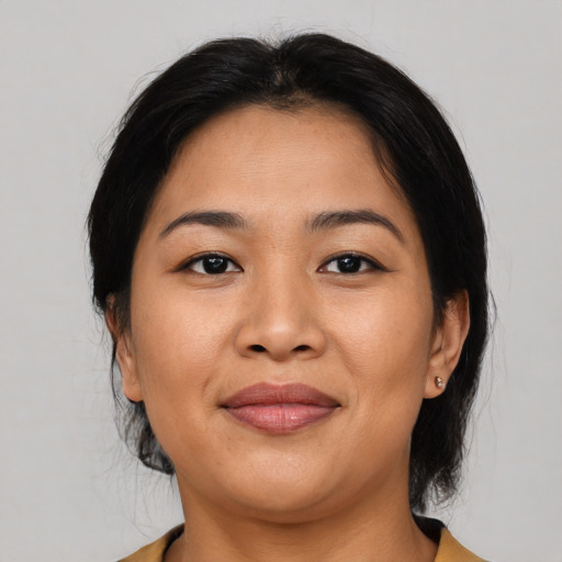 Joyful asian young-adult female with medium  black hair and brown eyes