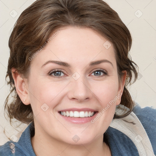 Joyful white young-adult female with medium  brown hair and blue eyes