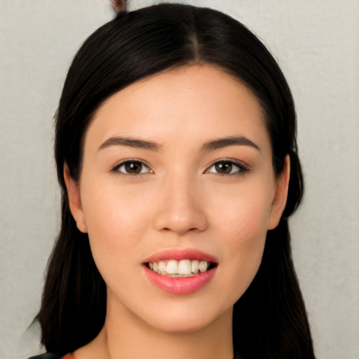 Joyful white young-adult female with long  black hair and brown eyes