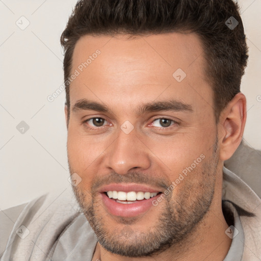 Joyful white young-adult male with short  brown hair and brown eyes