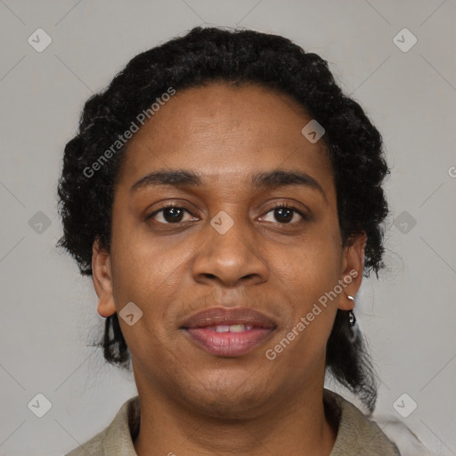 Joyful black young-adult female with short  black hair and brown eyes