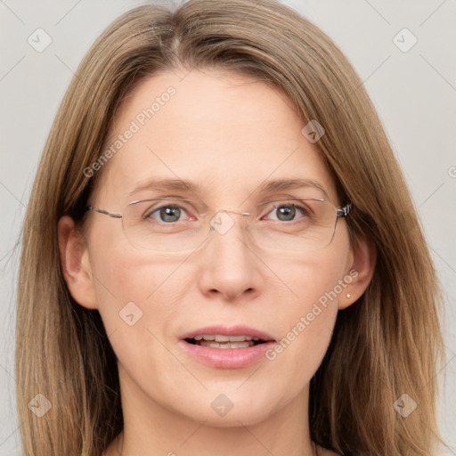 Joyful white adult female with long  brown hair and grey eyes