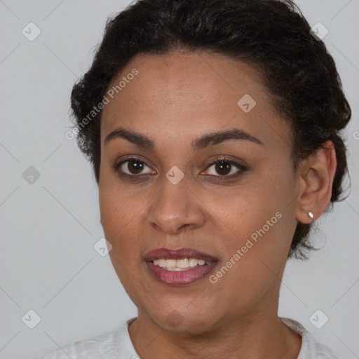 Joyful black young-adult female with short  brown hair and brown eyes