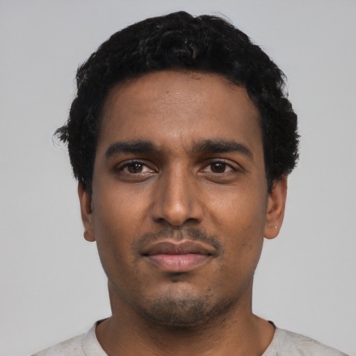 Neutral black young-adult male with short  black hair and brown eyes