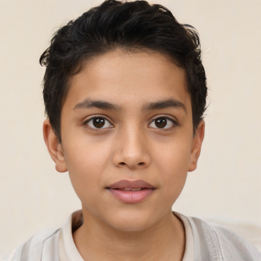 Joyful latino child female with short  brown hair and brown eyes