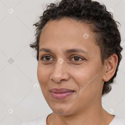 Joyful white adult female with short  brown hair and brown eyes