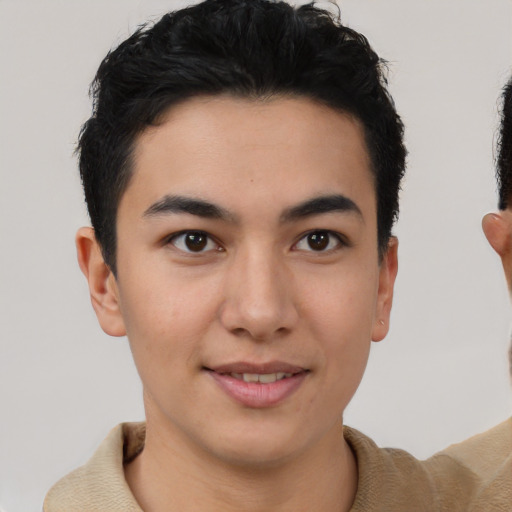 Joyful latino young-adult male with short  brown hair and brown eyes