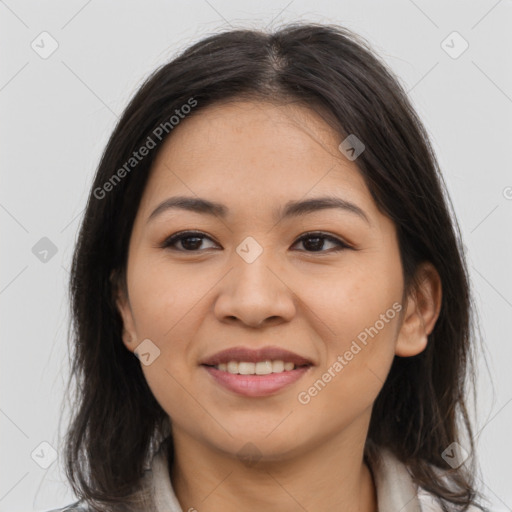 Joyful latino young-adult female with long  brown hair and brown eyes