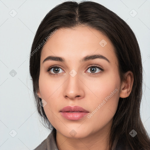 Neutral white young-adult female with long  brown hair and brown eyes