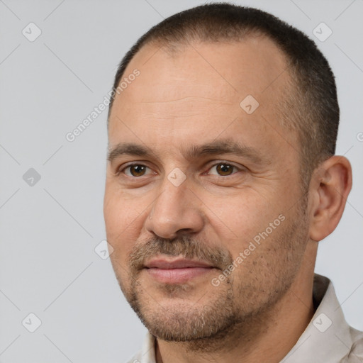 Joyful white adult male with short  brown hair and brown eyes