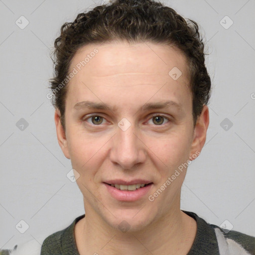 Joyful white adult female with short  brown hair and grey eyes