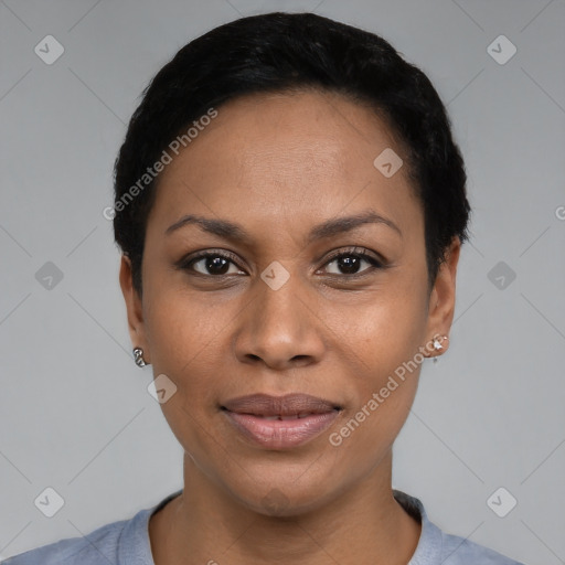 Joyful black young-adult female with short  black hair and brown eyes