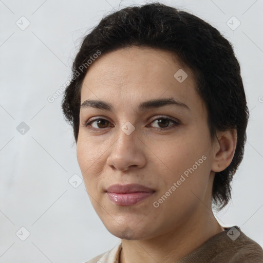 Joyful white young-adult female with short  brown hair and brown eyes