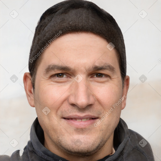 Joyful white adult male with short  brown hair and brown eyes