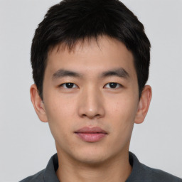 Neutral asian young-adult male with short  brown hair and brown eyes