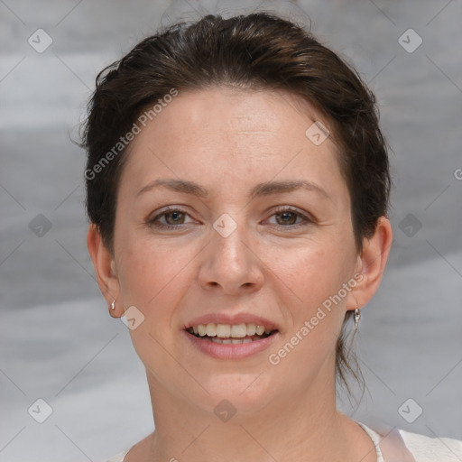 Joyful white adult female with short  brown hair and brown eyes