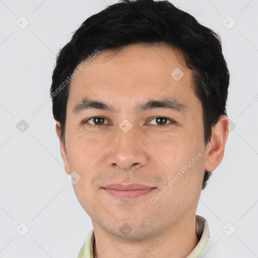 Joyful asian young-adult male with short  brown hair and brown eyes