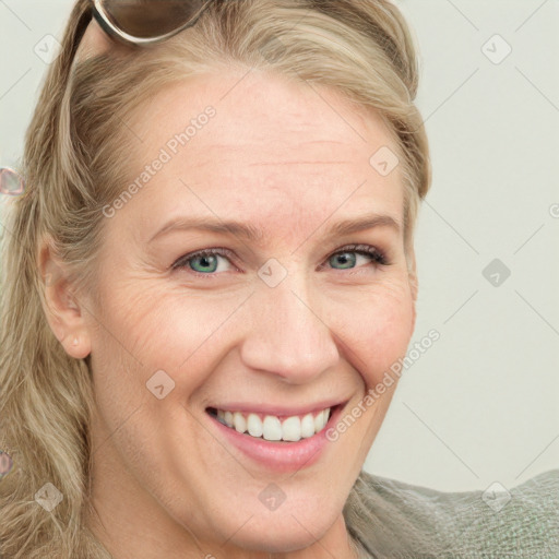 Joyful white young-adult female with medium  brown hair and blue eyes