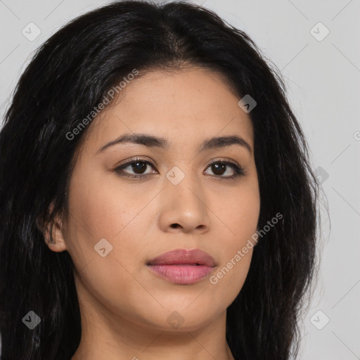 Joyful latino young-adult female with long  brown hair and brown eyes