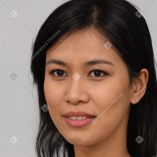 Joyful asian young-adult female with long  black hair and brown eyes