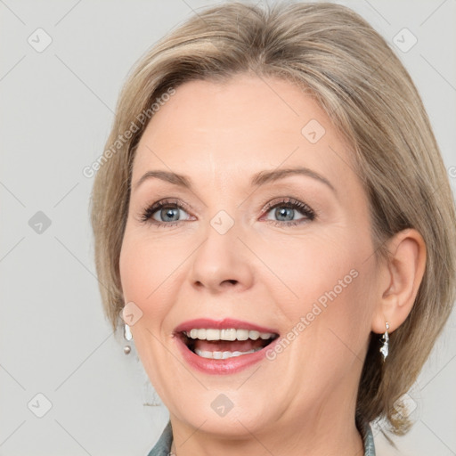 Joyful white adult female with medium  brown hair and grey eyes