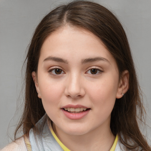 Joyful white child female with medium  brown hair and brown eyes