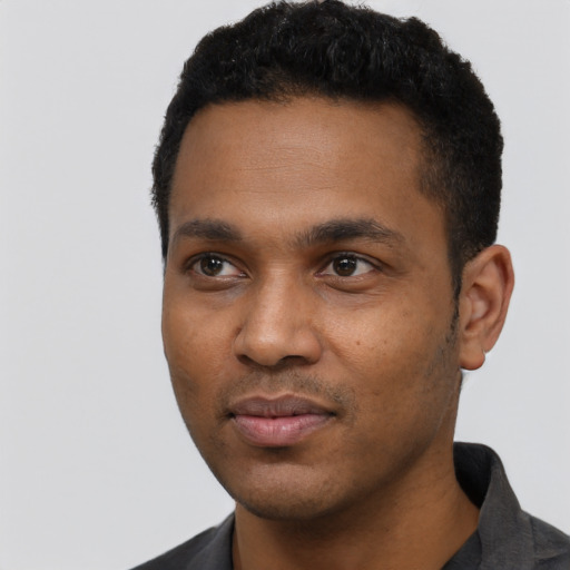 Neutral black young-adult male with short  black hair and brown eyes