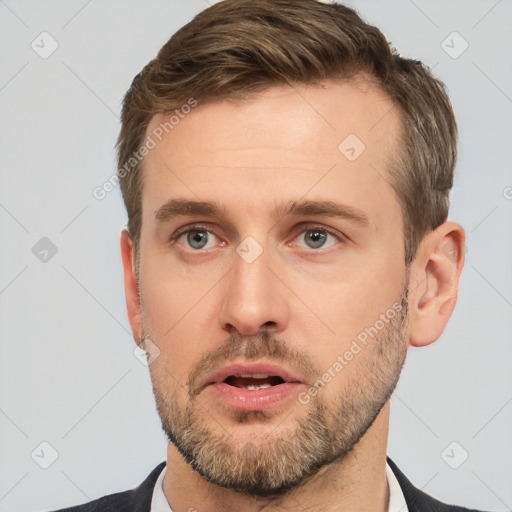 Neutral white young-adult male with short  brown hair and brown eyes