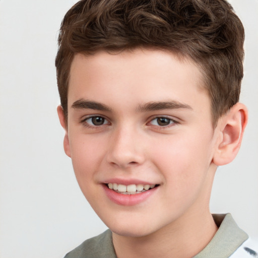 Joyful white child male with short  brown hair and brown eyes