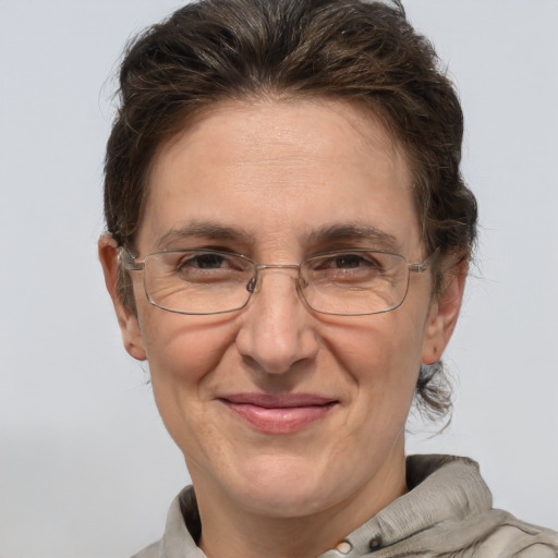 Joyful white middle-aged female with short  brown hair and brown eyes