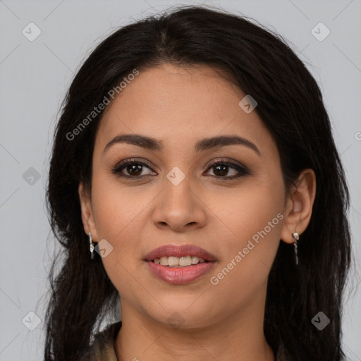 Joyful latino young-adult female with long  brown hair and brown eyes