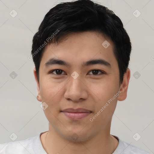 Joyful asian young-adult male with short  black hair and brown eyes