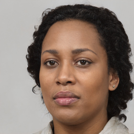Neutral black young-adult female with medium  black hair and brown eyes