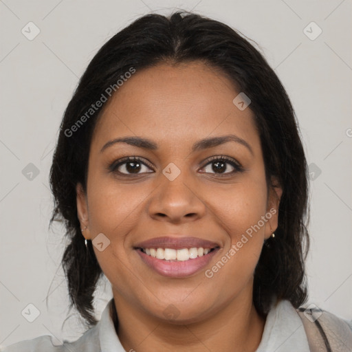 Joyful black young-adult female with medium  brown hair and brown eyes