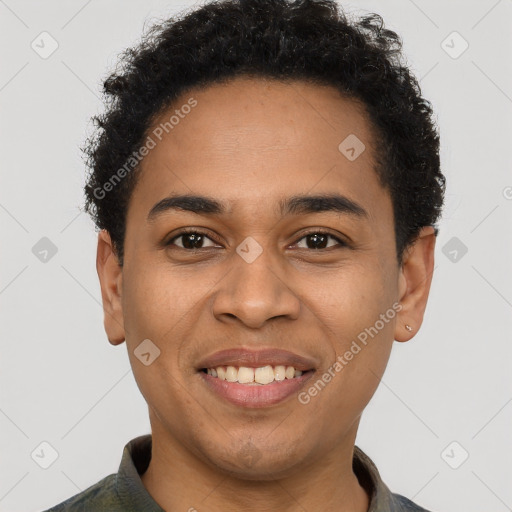 Joyful latino young-adult male with short  brown hair and brown eyes