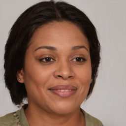 Joyful white adult female with medium  brown hair and brown eyes