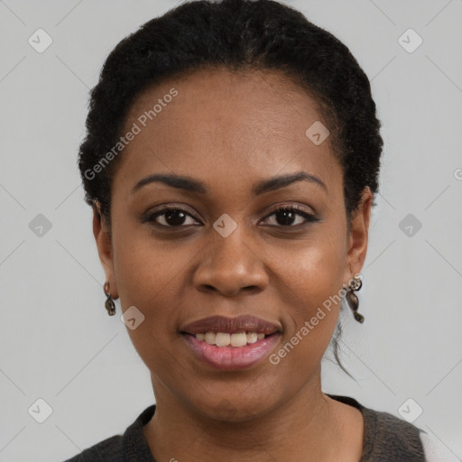 Joyful black young-adult female with short  black hair and brown eyes