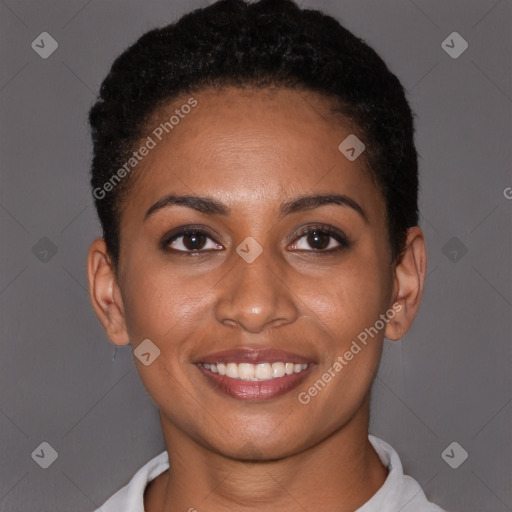 Joyful black young-adult female with short  brown hair and brown eyes