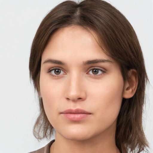 Neutral white young-adult female with medium  brown hair and brown eyes