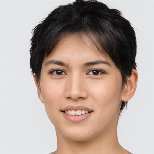 Joyful asian young-adult female with short  brown hair and brown eyes