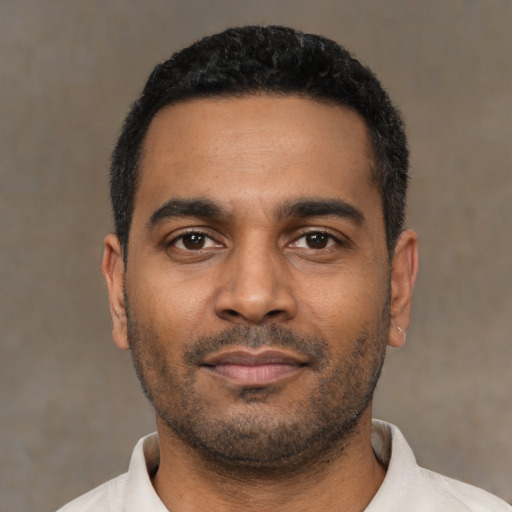 Neutral black young-adult male with short  black hair and brown eyes