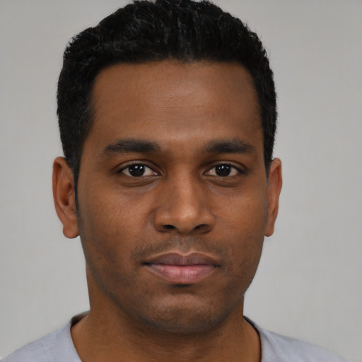 Neutral black young-adult male with short  black hair and brown eyes