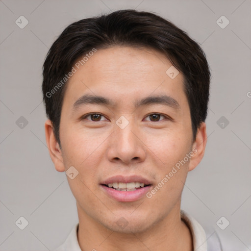 Joyful asian young-adult male with short  brown hair and brown eyes