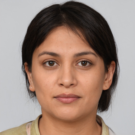 Neutral white young-adult female with medium  brown hair and brown eyes